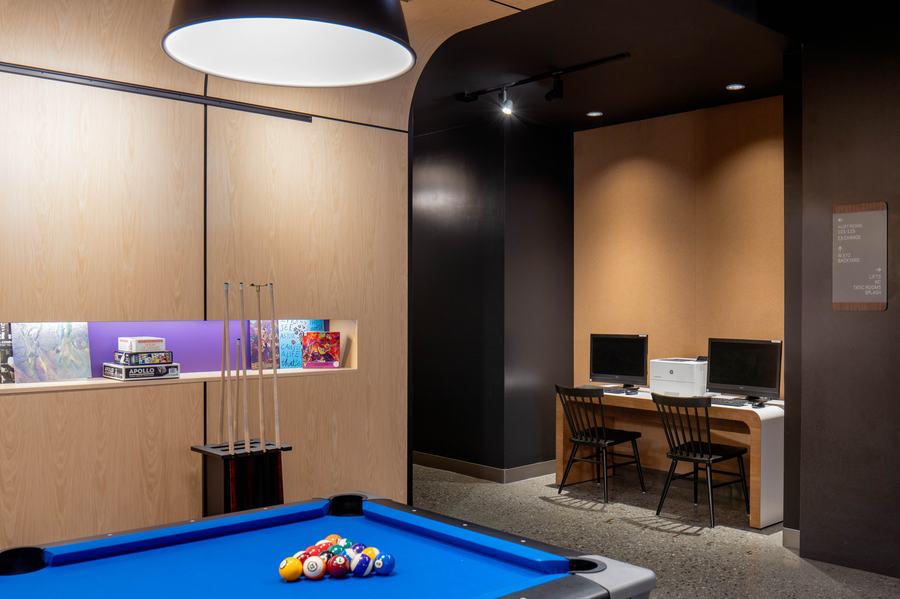Business center with pool table and workstations