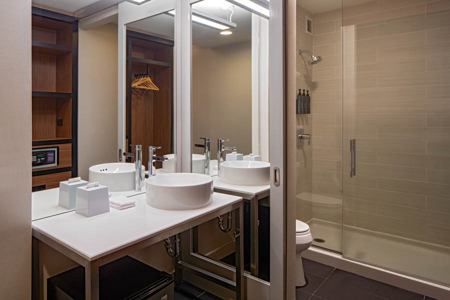 Guest bathroom with vessel sink and glass shower