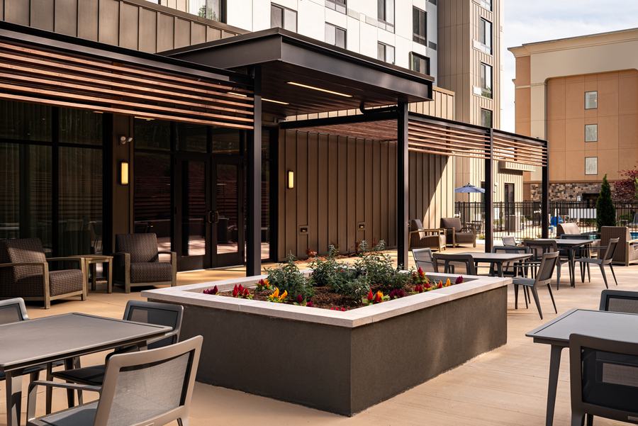 Outdoor courtyard with planters and seating