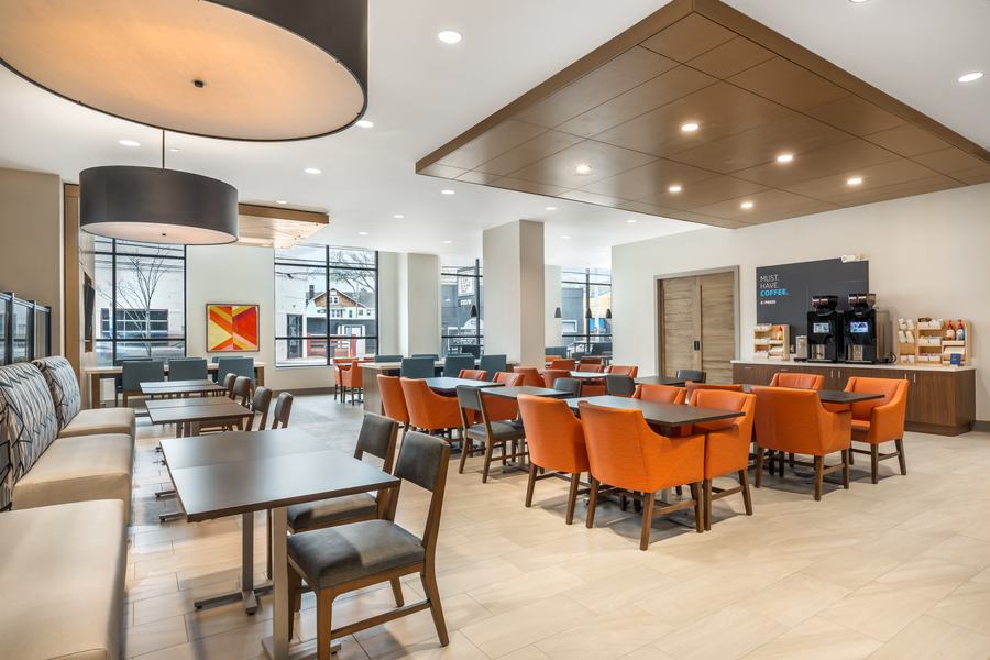 Dining area with orange chairs
