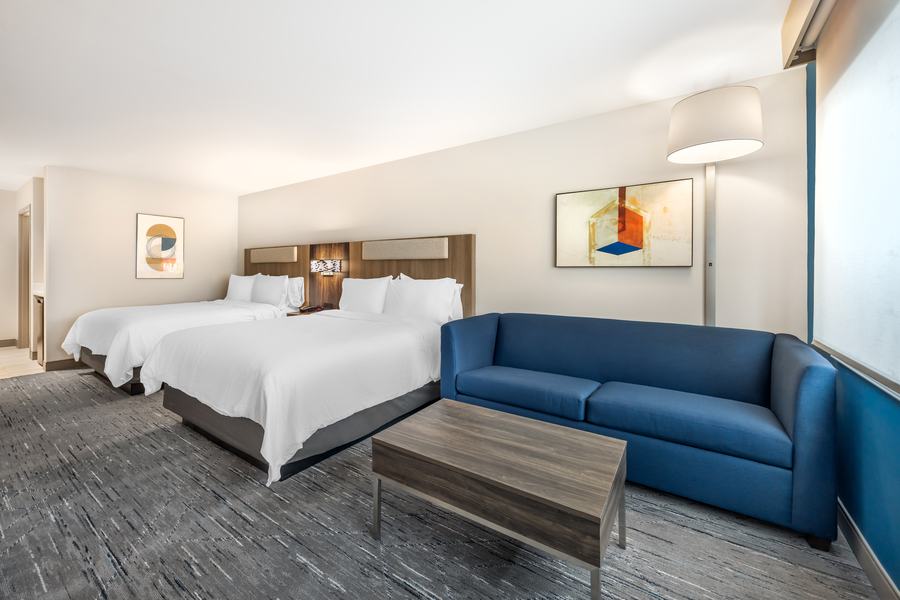 Two-queen guest room with sofa
