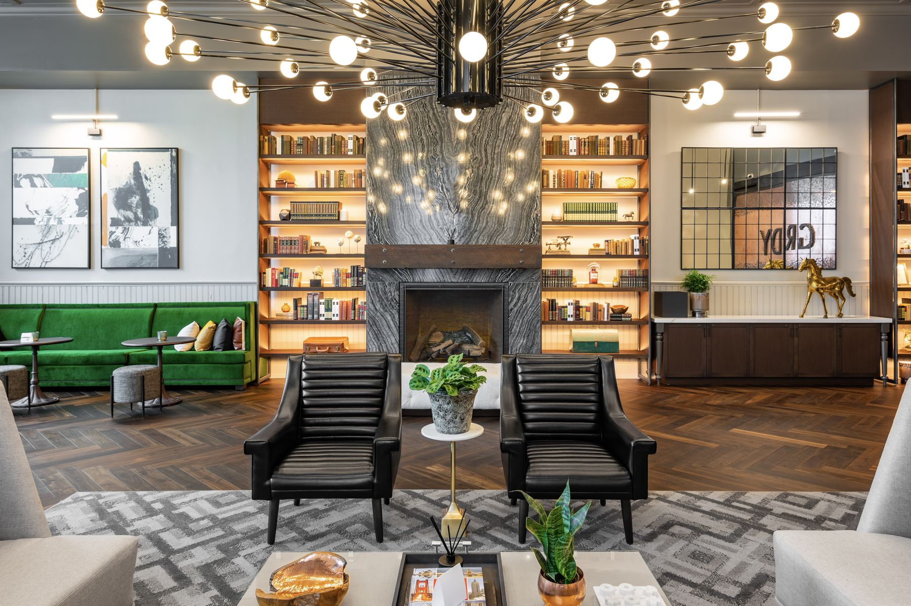 Lobby lounge with fireplace and backlit bookshelves