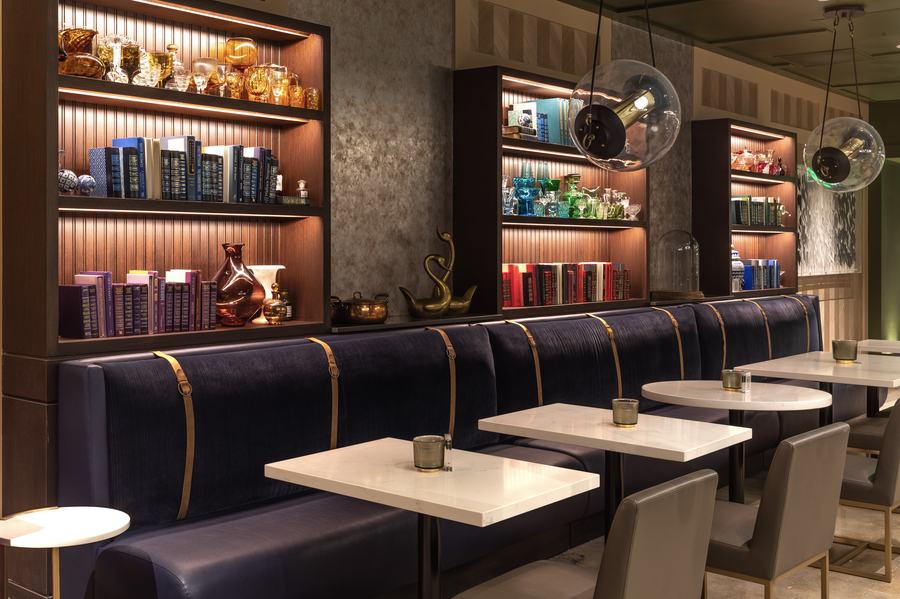 Banquette dining with backlit shelving
