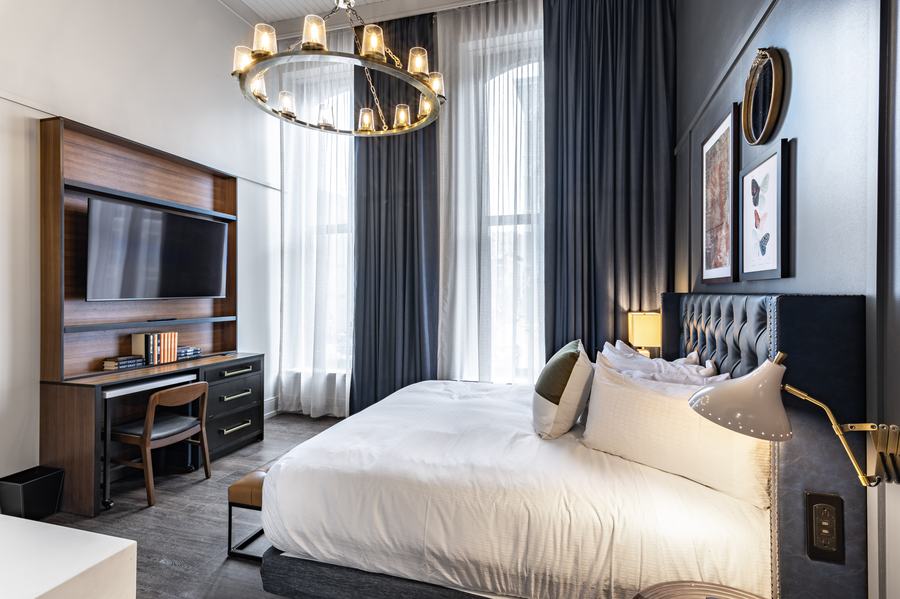 King guest room with tufted headboard