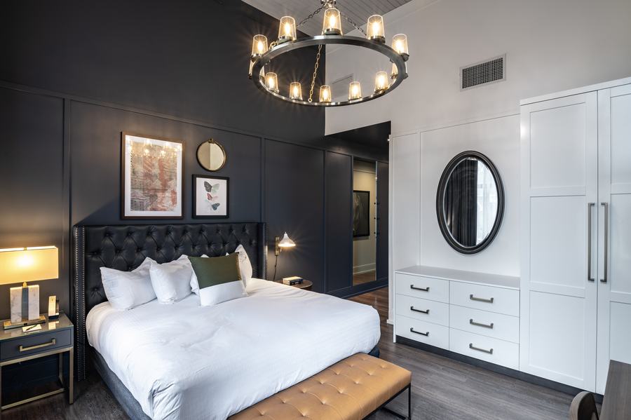 King guest room with ring chandelier