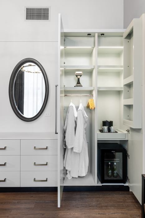 Wardrobe with robes and minibar